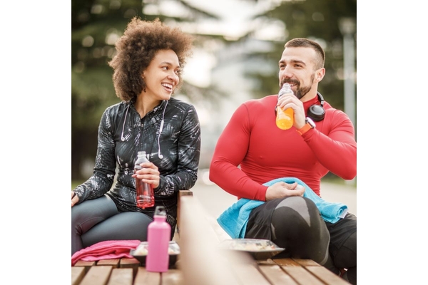 Image A man and woman drinking sports beverages.